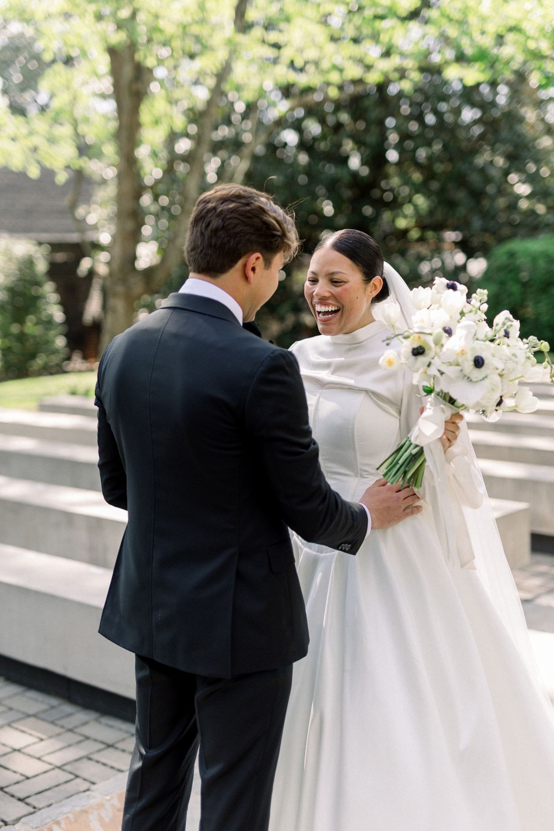a bride and bridesmaids beneath umbrellas at Belle Étoile Manor